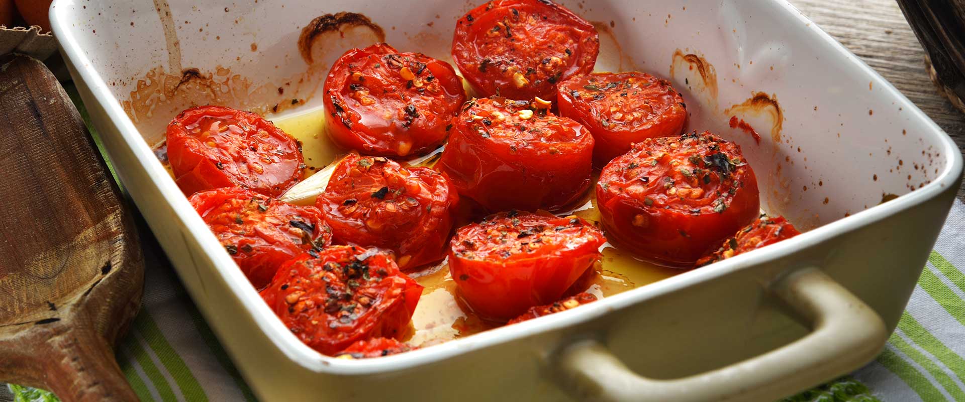 Pomodori gratinati con filetti di acciuga e prezzemolo